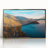 Large art print of Lake Tahoe with a mid-century modernist style in muted blue and green tones, framed in acrylic.