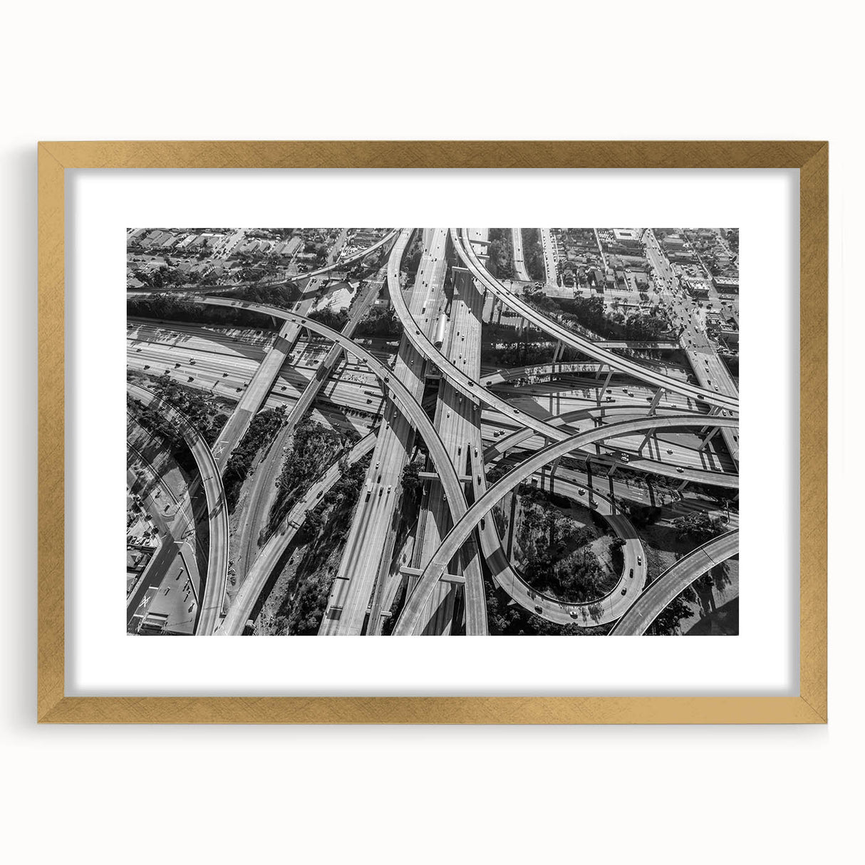 Extra large abstract art print of Los Angeles skyline with textured details in muted gold and blue tones, framed in gold.