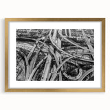 Extra large abstract art print of Los Angeles skyline with textured details in muted gold and blue tones, framed in gold.