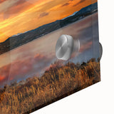 Large abstract wall art of the Rocky Mountains in muted earth tones on acrylic glass, suitable for dining room ambiance.