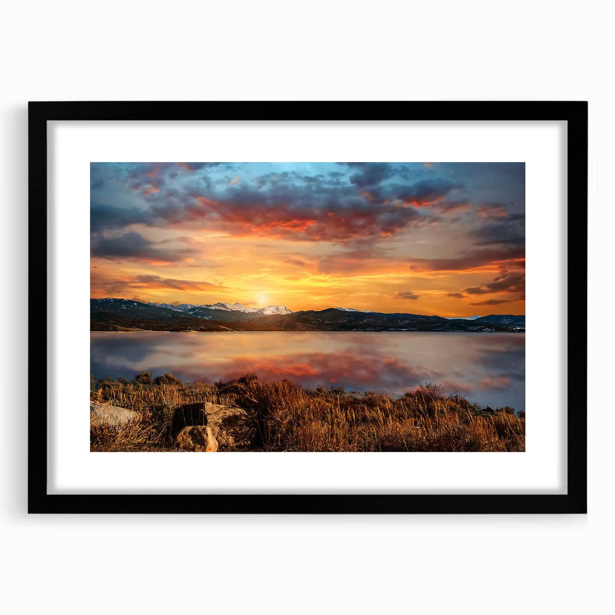 Textured abstract art print of the Colorado Rocky Mountains in vibrant colors, framed in black, ideal for living room decor.