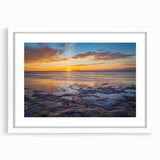 Abstract art print of the Florida Keys in muted blue and green tones on a framed white mat, suitable for dining room decor.