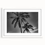 Abstract art print of Miami skyline in muted blue and orange tones on a framed white mat, ideal for dining room decor.