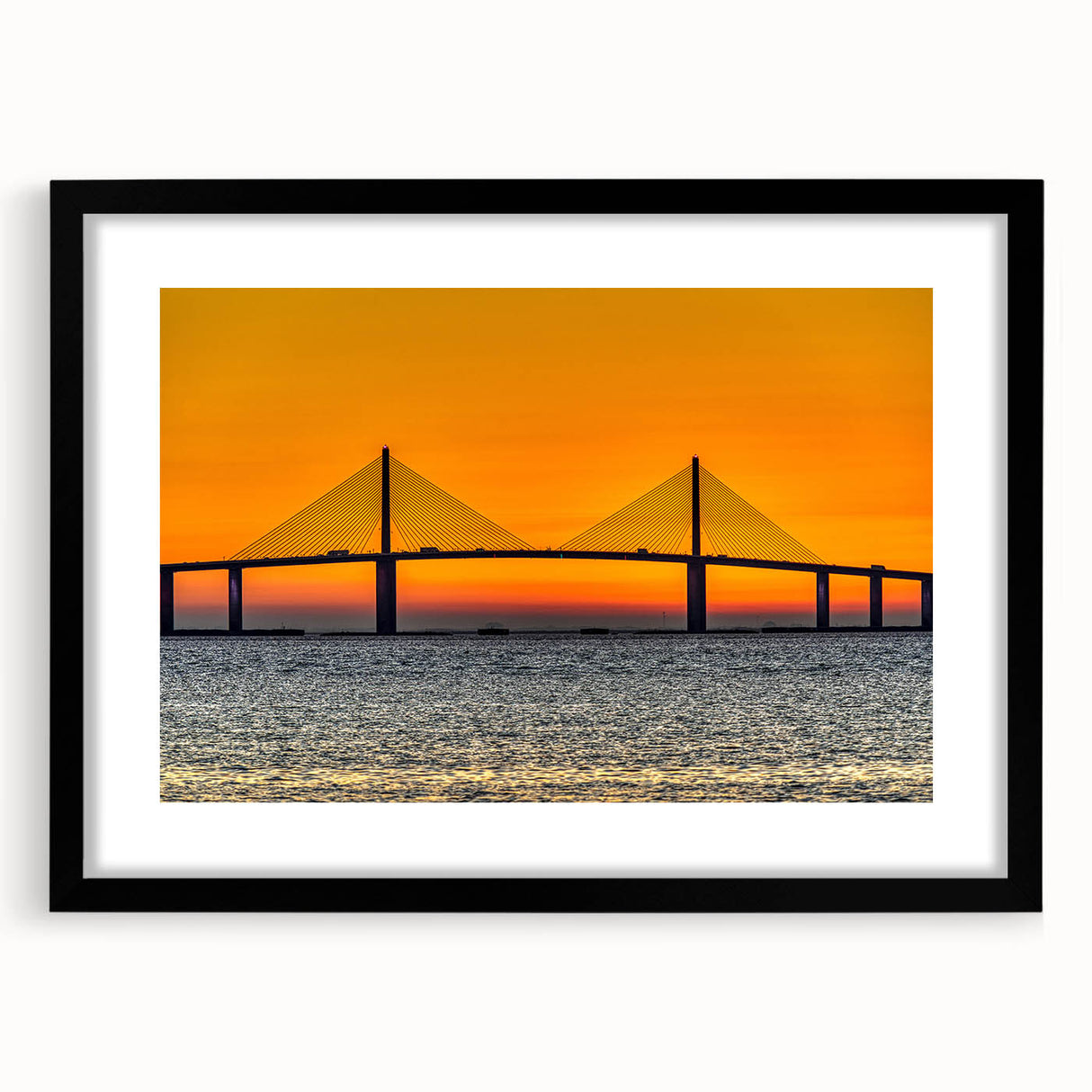 Abstract art print of Tampa scenery in vibrant, colorful textures on a large black-framed canvas.
