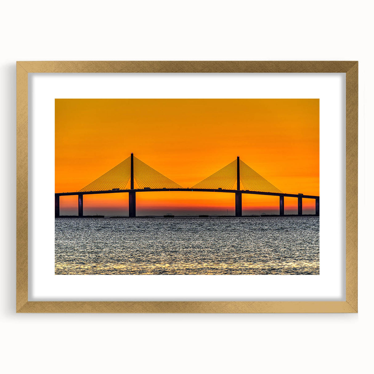Extra large abstract art print depicting the Tampa skyline in vibrant blues and oranges, framed in gold.