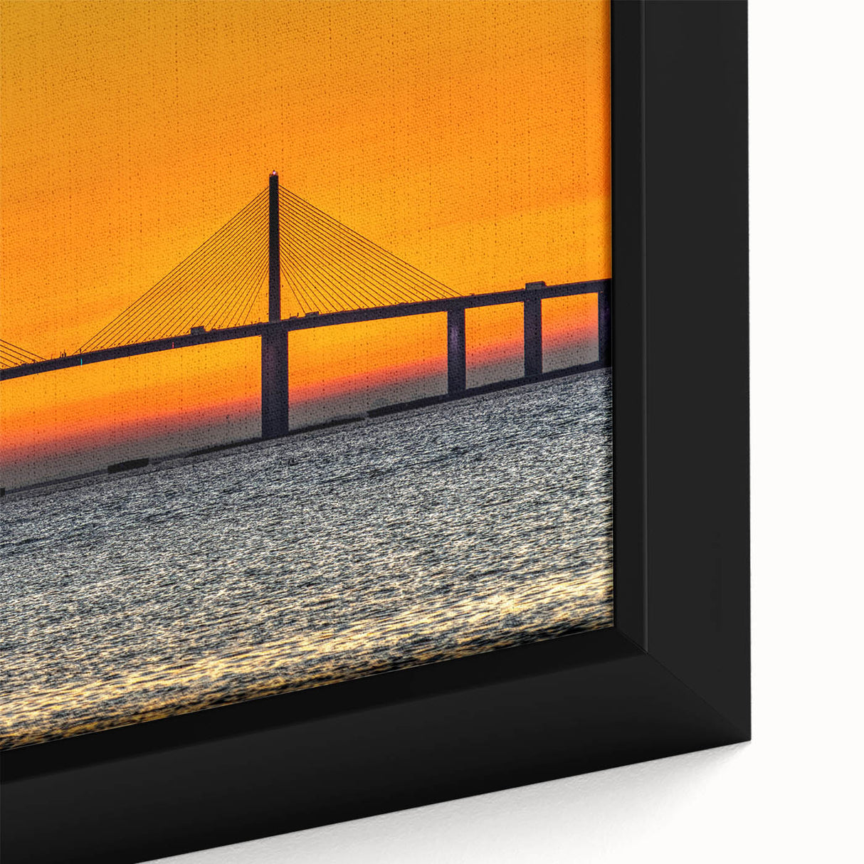 Close-up of a framed canvas featuring a textured depiction of the Tampa skyline in black with colorful accents.