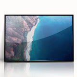 Large abstract wall art depicting Kauai's lush landscapes in green and blue tones, framed in black acrylic.