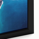 Close-up of a textured, extra large black wall art depicting colorful Kauai scenery on a framed canvas.