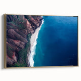 Framed canvas wall art of Kauai landscape in muted green and gold tones, suitable for bedroom decor.