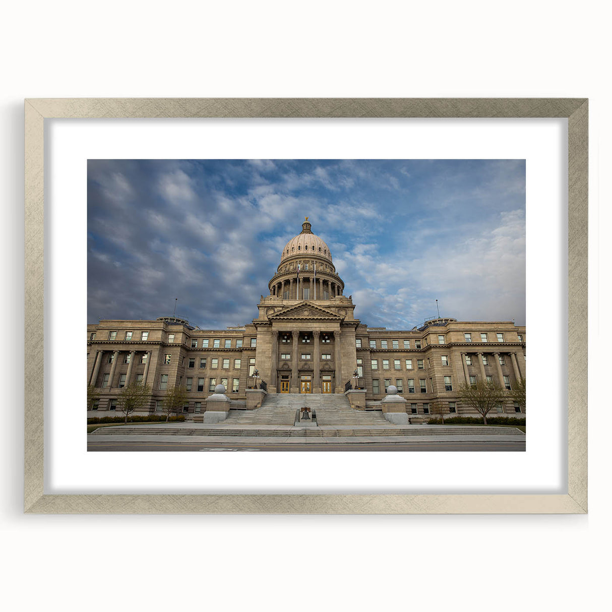 Textured abstract art print depicting a serene Idaho landscape in muted earth tones, framed in silver, ideal for bedroom art.