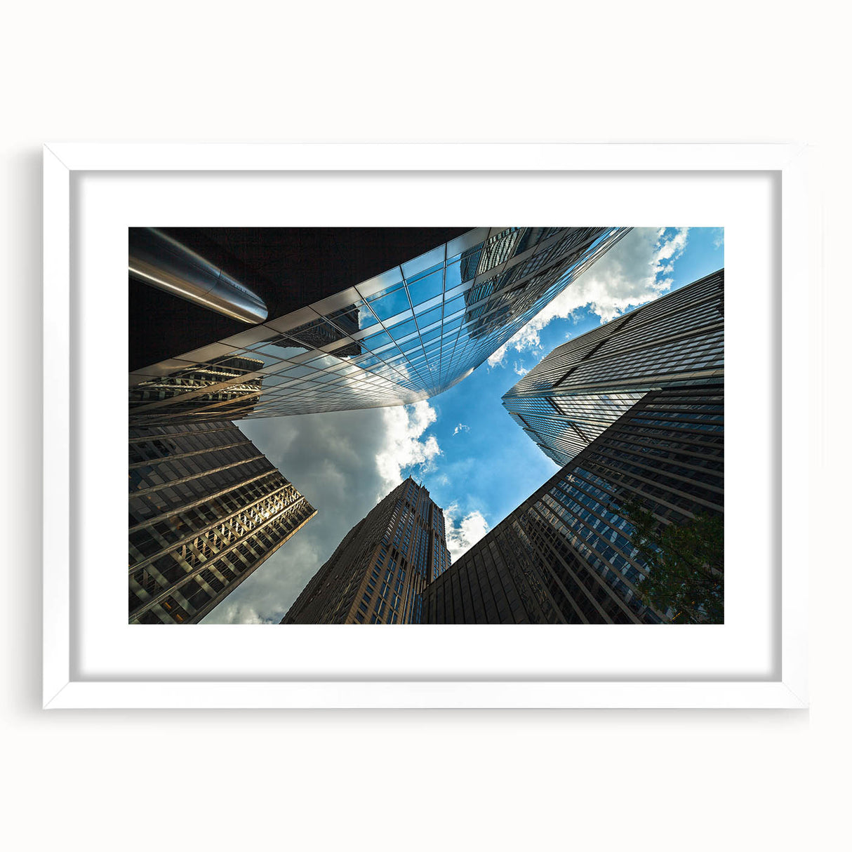 Abstract art print of Chicago skyline in muted gray and blue tones on a framed white mat, suitable for dining room decor.