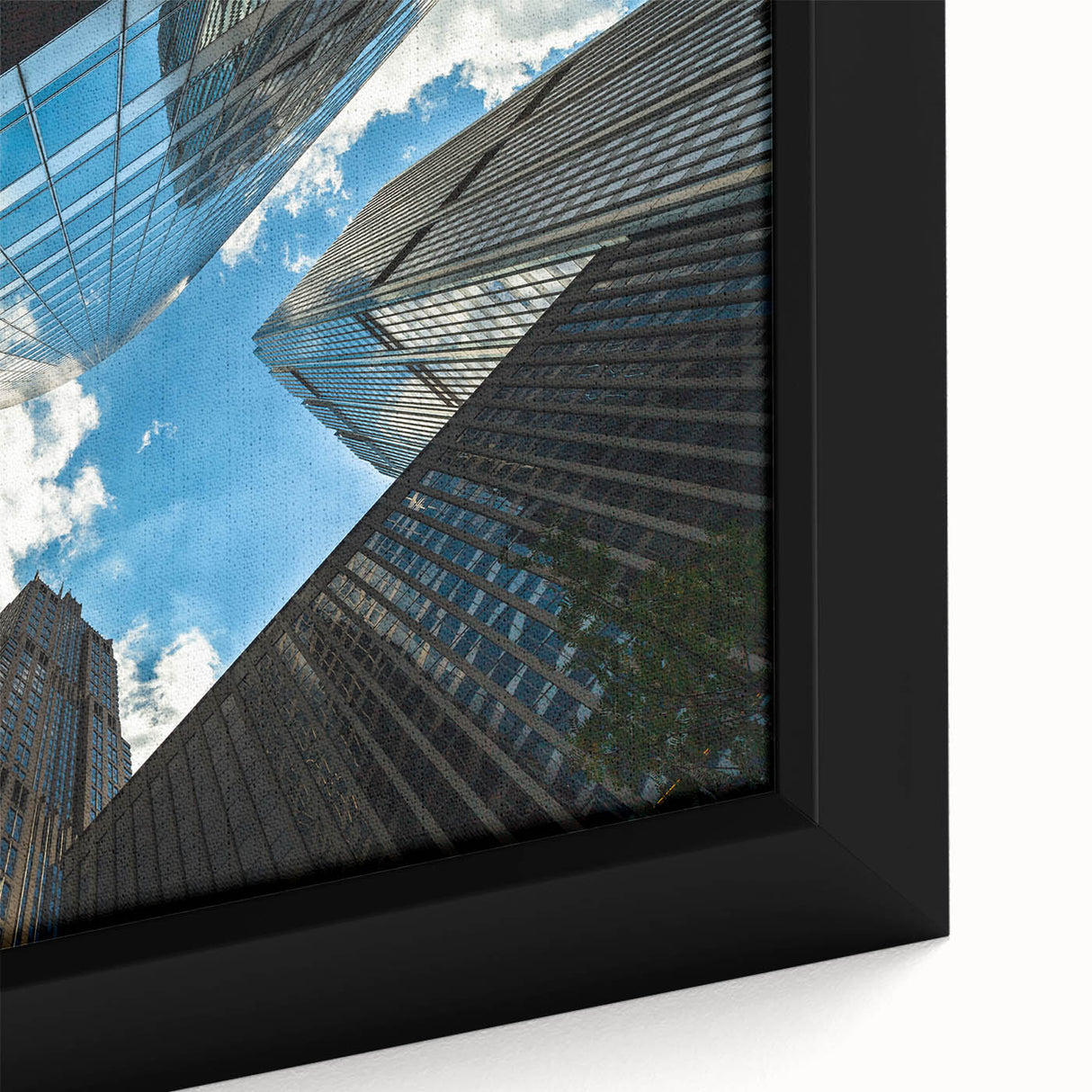 Close-up of a textured, black wall art piece featuring a colorful Chicago skyline, framed on canvas.