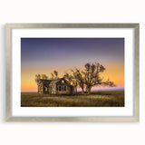 Textured abstract art print of Kansas scenery in muted earth tones on a framed silver mat, ideal for bedroom decor.