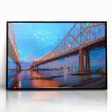 Large abstract wall art depicting a stylized New Orleans scene in muted earth tones, framed in black acrylic.