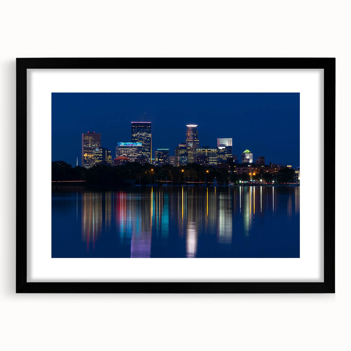 Extra large abstract art print of Minneapolis skyline in textured tones of blue and gray, framed with a black mat.