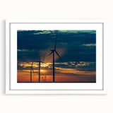 Abstract art print of Kansas City skyline in muted blue and gray tones on a white framed mat, suitable for dining room decor.