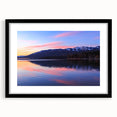 Abstract art print of a Montana landscape in vibrant colors on a large framed canvas, suitable for living room decor.