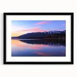 Abstract art print of a Montana landscape in vibrant colors on a large framed canvas, suitable for living room decor.