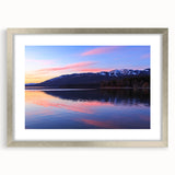 Textured abstract art print of Montana scenery in muted earth tones, framed with a silver mat, suitable for bedroom decor.