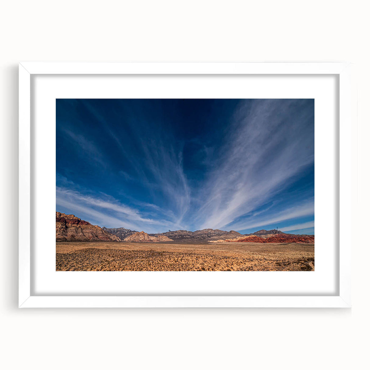 Abstract art print of Las Vegas skyline in muted gray and blue tones on a framed white mat, suitable for dining room decor.