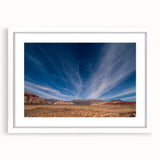 Abstract art print of Las Vegas skyline in muted gray and blue tones on a framed white mat, suitable for dining room decor.