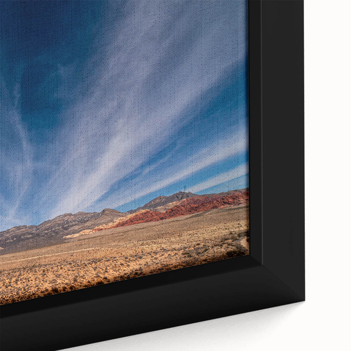 Close-up of textured black wall art featuring a colorful Las Vegas scene on a framed canvas.