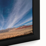 Close-up of textured black wall art featuring a colorful Las Vegas scene on a framed canvas.