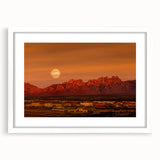 Abstract art print of New Mexico scenery in muted earth tones, framed with a white mat, ideal for dining room decor.