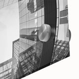 Large abstract wall art of Charlotte skyline in muted gray and blue tones on acrylic glass, ideal for dining room decor.