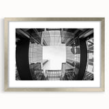 Textured abstract art print of Charlotte skyline in muted gray tones on a framed silver mat, suitable for bedroom decor.