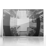 Modern art wall decor featuring a Charlotte, North Carolina skyline in muted gray tones on a white framed acrylic print.