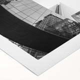 Art deco poster of Charlotte skyline in muted blue tones on rolled canvas, ideal for dining room wall art.