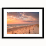 Colorful abstract art print of Outer Banks, featuring vibrant blue and orange hues on a large framed canvas.