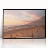 Large abstract wall art depicting the Outer Banks in muted blue and gray tones, framed in black acrylic.