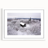 Abstract art print of Adirondack scenery in muted earth tones, framed in white, ideal for dining room decor.