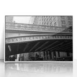 Art Deco style poster of NYC's Grand Central, with muted gray tones on white framed acrylic.