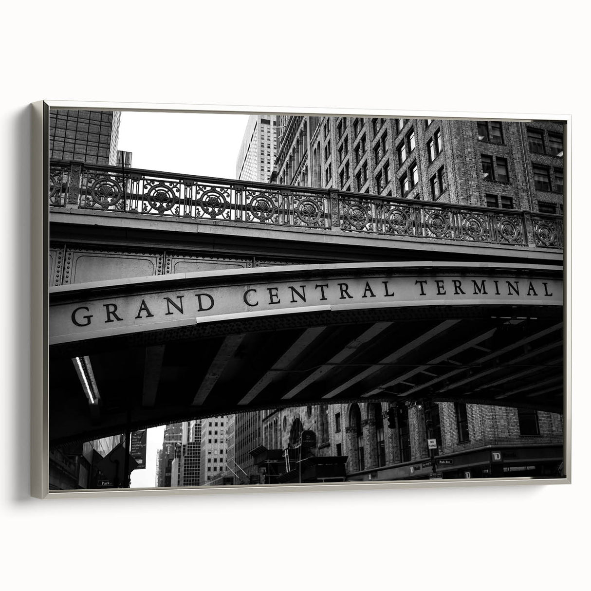 Framed canvas of a vintage-style NYC Grand Central scene in black with colorful accents, ideal for office decor.