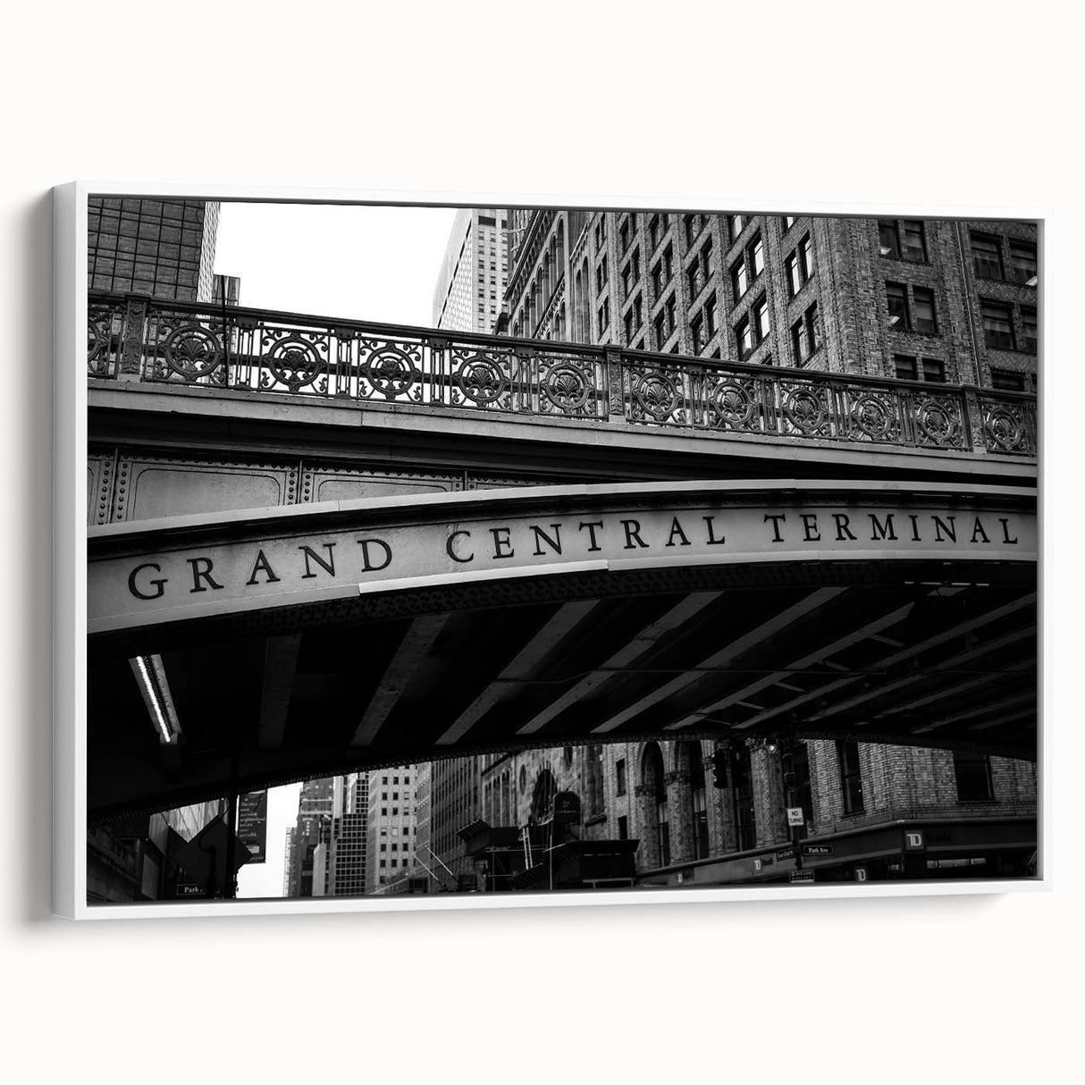 Vintage poster art of Grand Central, featuring a monochrome design with colorful accents on white framed canvas.