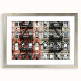 Textured art print of abstract Manhattan skyline in muted silver and gray tones, framed in silver, ideal for bedroom decor.