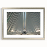 Textured art print of NYC Trade Center in abstract style with muted grays, framed in silver, ideal for bedroom decor.