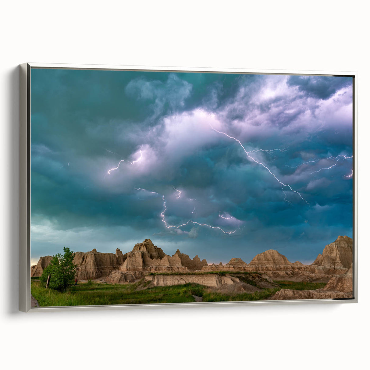 Framed canvas of a vintage-style landscape art painting depicting South Dakota Badlands in muted earth tones.