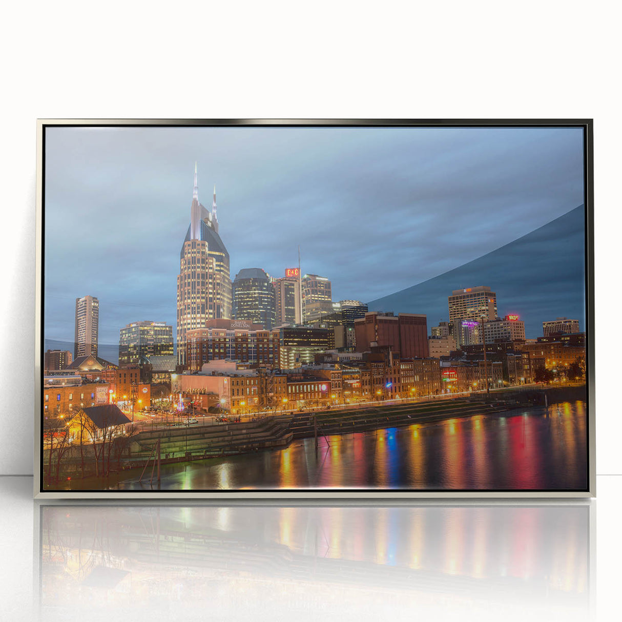 Mid-century modernist art of Nashville skyline in muted earth tones on a silver-framed acrylic print.