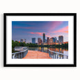 Colorful abstract art print of Austin skyline in vibrant hues on a large framed canvas, ideal for living room decor.