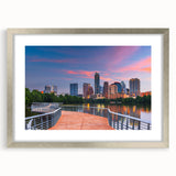 Textured art print of abstract Austin skyline in muted blues and grays on a framed silver mat, suitable for bedroom decor.