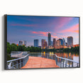 Black and white wall art featuring a vintage-style landscape painting of Austin, Texas on a framed canvas.