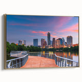 Framed canvas featuring a vintage-style landscape painting of the Austin, Texas skyline in black and gold tones.