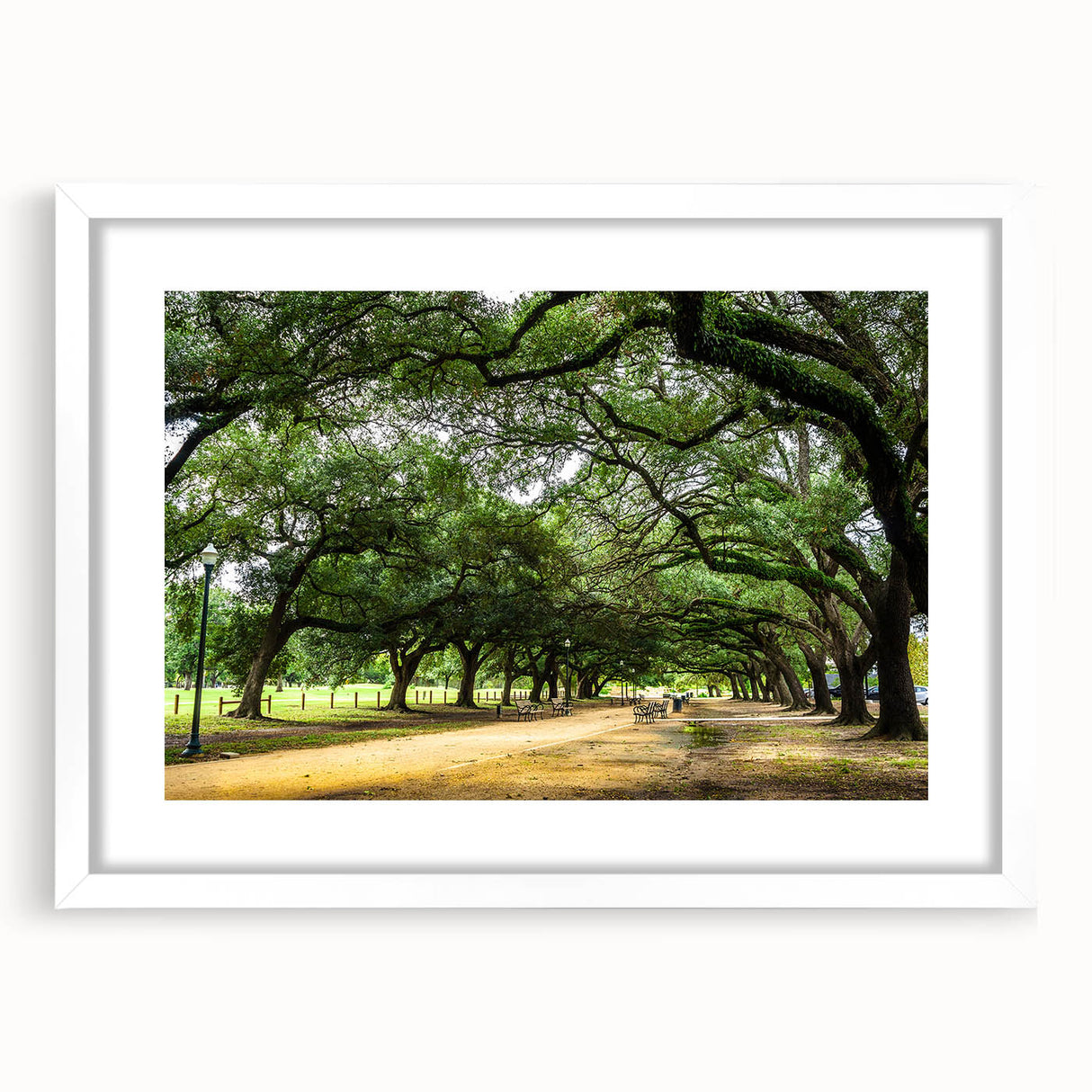 Abstract art print of Houston skyline in muted gray and blue tones on a framed white mat.