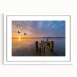 Abstract art print of Vermont scenery in muted earth tones, framed with a white mat, suitable for dining room decor.