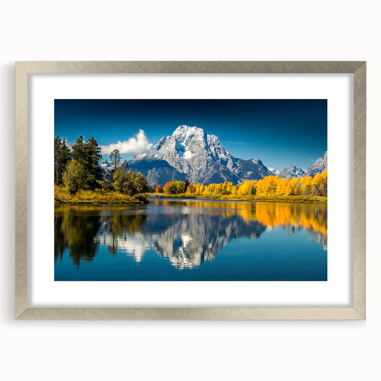 Textured art of the Grand Tetons in muted earth tones on a framed silver mat, suitable for bedroom decor.