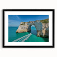 Black-framed landscape artwork showcasing dramatic cliffs and a serene sky, elegantly matted for a polished presentation, ideal for home decor enhancement.